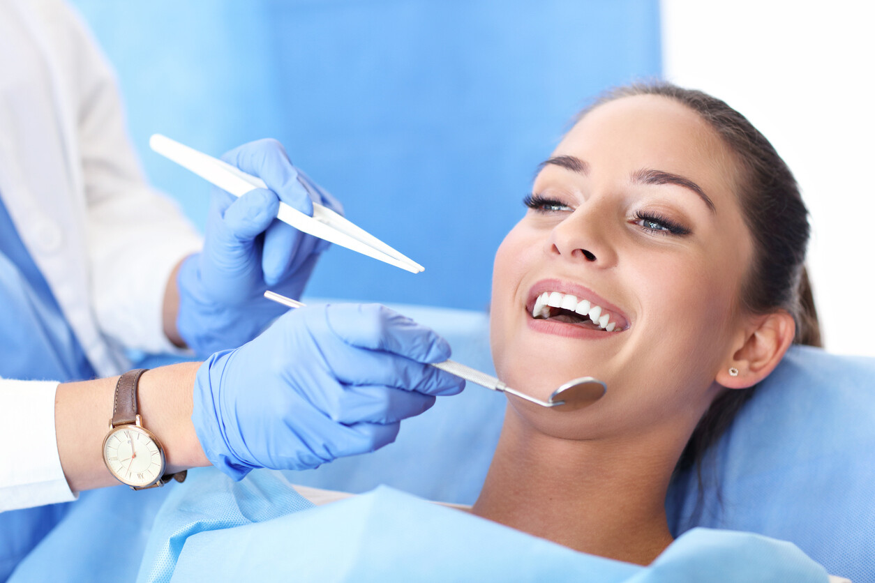 Woman Smiling At Dentist